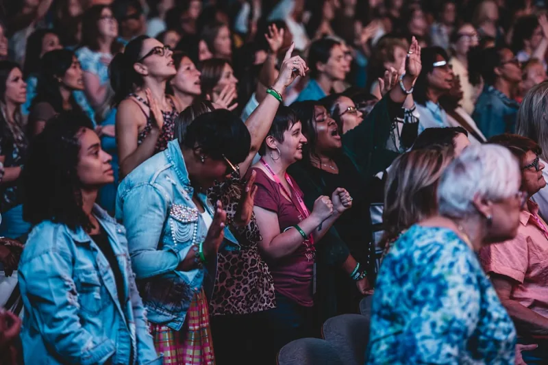 Women gathered in the Priceless auditorium