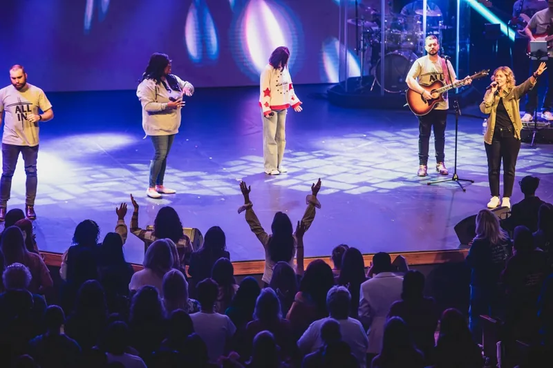 Musicians leading worship on the Priceless stage